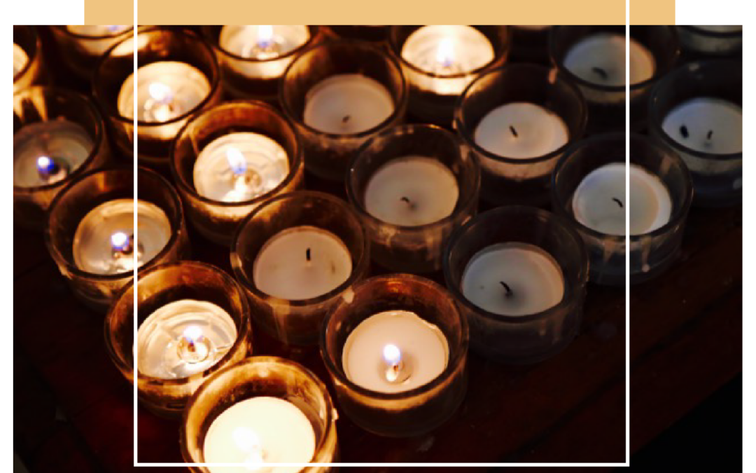 Congregation holding candles during acoustic worship service at Platt Park Church